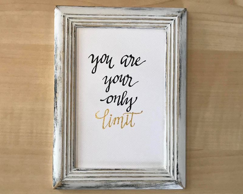 Hand Lettered Calligraphy Quote in black and gold ink, "you are your only limit"